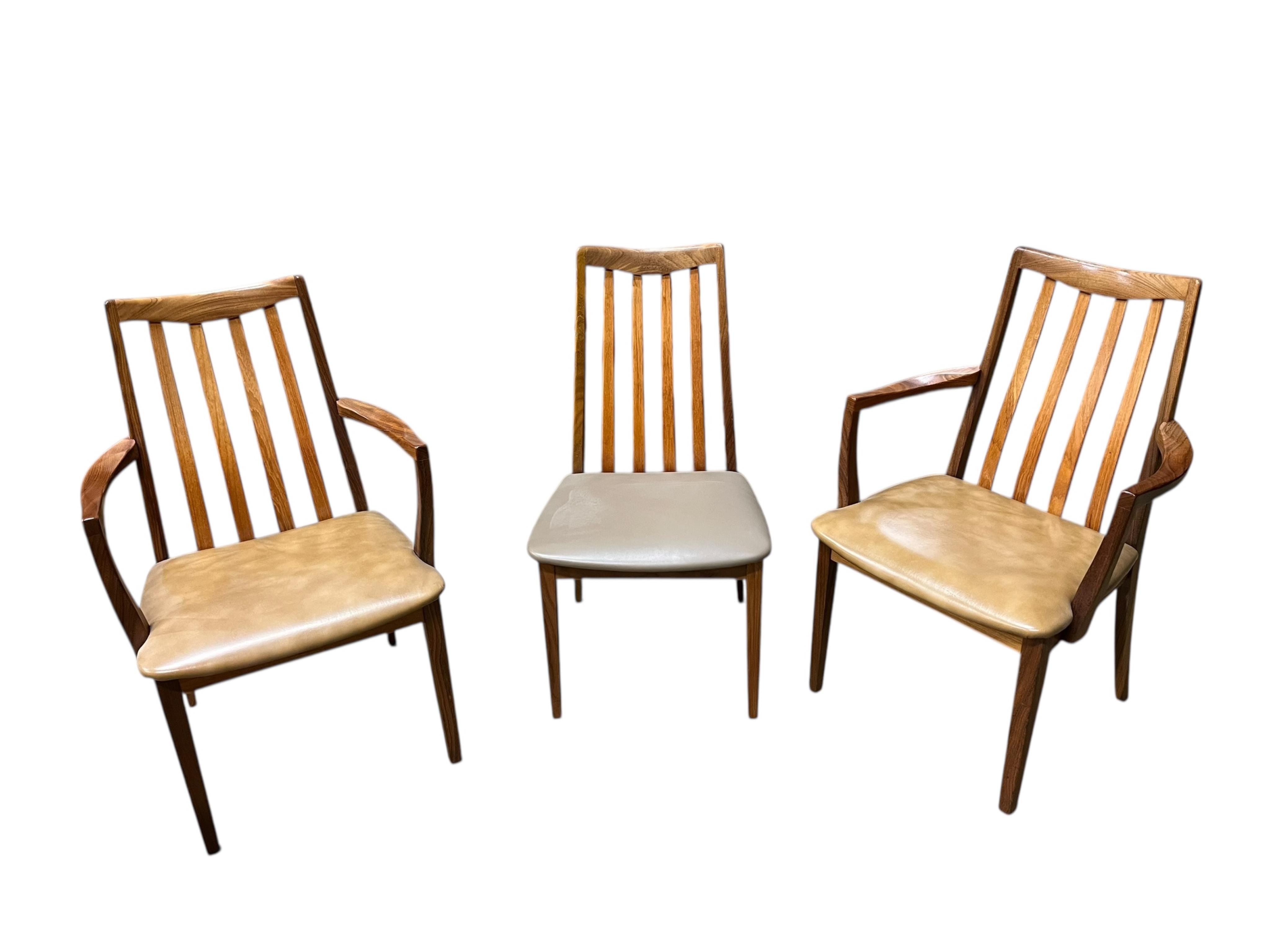 A mid century G Plan Fresco teak dining suite comprising dining table 184cm extended, depth 116cm, height 73cm, six chairs, two with arms and a four door sideboard, width 152cm